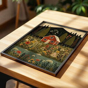 May include: Framed art print featuring a whimsical illustration of a red house nestled in a vibrant meadow. The artwork showcases a serene landscape with a river, colorful flowers, and tall trees, all set against a mountain backdrop. The print is encased in a black frame.