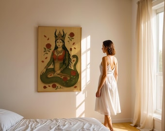 May include: A framed artwork depicts a seated figure with a snake body, wearing a crown and red and green clothing. Red roses and leaves are scattered around the figure. The artwork is hanging on a beige wall.
