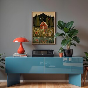 May include: A teal blue cabinet with a red lamp, a black appliance, and a framed picture of a red house in a field. Potted plants are on the cabinet and on a wooden stool. The background is a gray wall.
