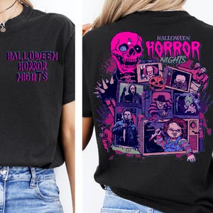 May include: Black t-shirt with the text "HALLOWEEN HORROR NIGHTS" in pink and purple. The back of the shirt features a pink skull and images of horror movie characters.
