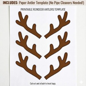 May include: A white sheet featuring six brown reindeer antler templates. The text at the top reads "INCLUDES: Paper Antler Template (No Pipe Cleaners Needed!)" and "PRINTABLE REINDEER ANTLERS TEMPLATE". The bottom text says "Cut out and attach to treat bags."