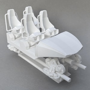 May include: A white model roller coaster car with four seats. The car has a protective front and is mounted on a track with multiple wheels. The seats have headrests and armrests.