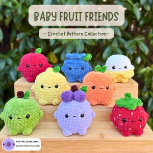 May include: A collection of handmade crochet fruit toys, including a red apple, blue blueberry, yellow lemon, orange, green apple, purple grape, white and yellow fruit, and a red strawberry. The toys have cute faces and green leaves. The text "BABY FRUIT FRIENDS" and "Crochet Pattern Collection" is displayed.