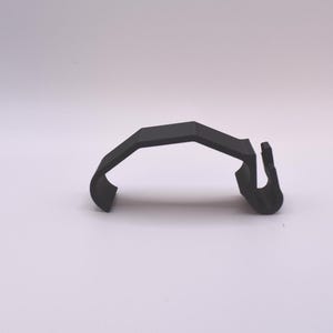 May include: A black plastic clip with a curved shape and a hook on one end.