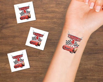May include: Temporary tattoos featuring a red race car with the number 4 and the name "Caleb". The design includes a checkered flag and a banner. One tattoo is applied to a wrist, and three others are on a wooden surface.