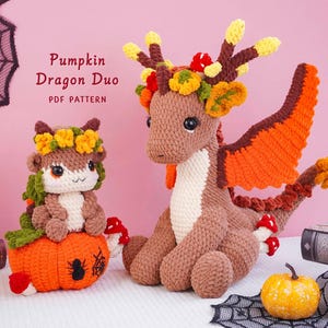 May include: Two crocheted dragon figures, one small sitting on an orange pumpkin and one larger standing, both in shades of brown, cream, and orange with floral accents. The text "Pumpkin Dragon Duo PDF PATTERN" is visible in the upper left corner.