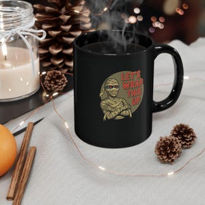 Black Mug, Lets Wrap This Up, 11oz 15oz Funny Retro Horror Monster Halloween Coffee Cup, Gift for Horror Movie Fans, Mummy Lover, Spooky