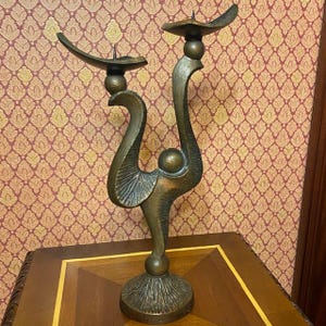 Vintage metal candlestick for two candles, in oriental style.