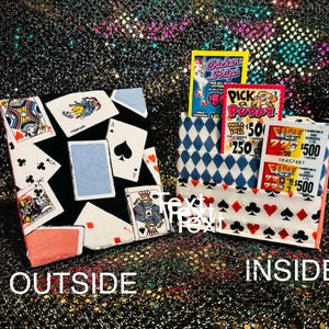 May include: Two fabric pouches with playing card and lottery ticket designs. One pouch features playing cards, the other has a diamond pattern and holds lottery tickets. The word "OUTSIDE" is written on the left pouch and "INSIDE" on the right.