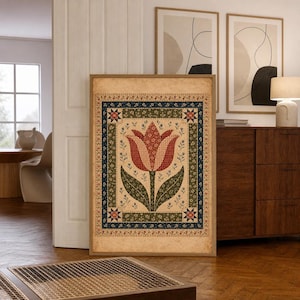 May include: A rectangular wall art print featuring a central red tulip illustration with green leaves, surrounded by a decorative border of blue, green, and cream floral patterns with small star motifs in each corner on a textured beige background.