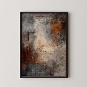 May include: Abstract art print in a black frame. The artwork features a textured surface with a blend of colors, including shades of brown, gray, and beige. The composition has a modern, artistic feel.