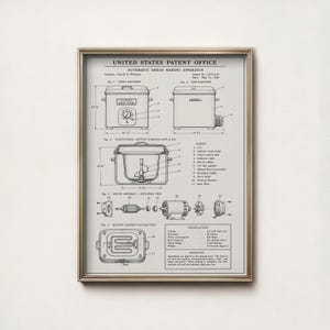May include: A framed United States Patent Office print for an automatic bread making apparatus. The black and white technical drawing displays various elevations, a cross-section, motor assembly, and heating element with labelled parts and dimensions.