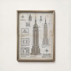 May include: Framed architectural blueprint of the Empire State Building, featuring detailed diagrams and elevations. The print showcases the building's structure, floor plans, and spire, with the title "Empire State Building" visible at the bottom.