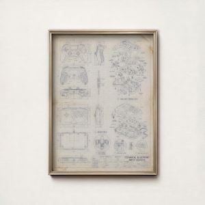 Puede incluir: Impresión artística enmarcada que muestra planos técnicos de mandos de videojuegos. La impresión muestra diagramas detallados de diferentes diseños de mandos, incluyendo componentes internos y especificaciones. El texto "TECHNICAL BLUEPRINT INPUT DEVICES" es visible.