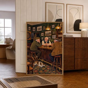 May include: A framed wall art print depicting three older individuals sitting at a wooden pub bar with glasses of beer. A dog lies on the patterned rug beneath the bar stools. The scene includes dark green walls, hanging pendant lights, and framed pictures.
