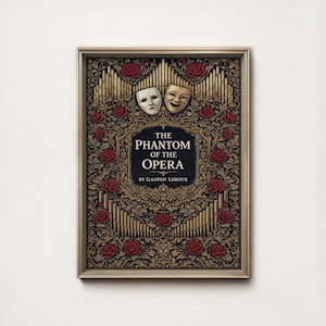 May include: Framed artwork featuring the title "The Phantom of the Opera" by Gaston Leroux. The design includes a decorative border, red roses, and two theatrical masks. The background is a mix of gold and black.