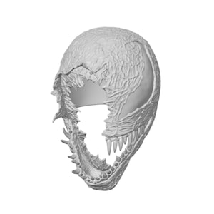 May include: A light gray, textured mask featuring a jagged, torn opening across the upper face and a wide, gaping mouth lined with sharp, pointed teeth. The surface displays a complex, vein-like pattern throughout the entire exterior structure.