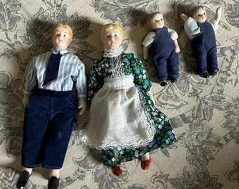 Vintage Collectible Bisque Dolls mother, father, and sons