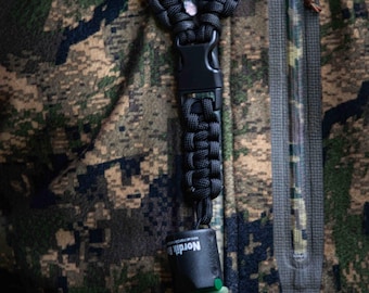 Cordão para travar // Cordão para chamadas de jogo (intercambiável)