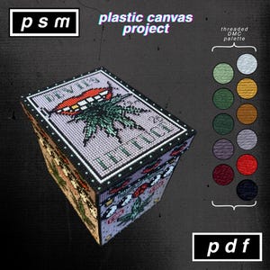 May include: A plastic canvas project box with a stitched design featuring a cannabis leaf and the text "DIVIL'S LETTUCE". The box has a black border and a color palette of thread colors. The text "psm" and "plastic canvas project" are also visible.