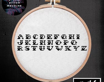 Amerikanische traditionelle Tattoo Blitz inspiriert Alphabet Schrift Kreuzstich Muster