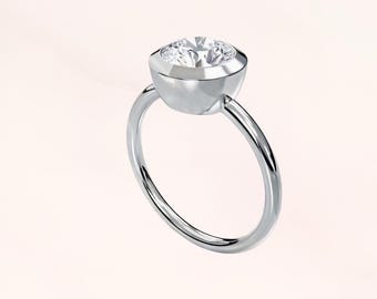 The minimalist design of the diamond ring embodies purity; love silently blossom
