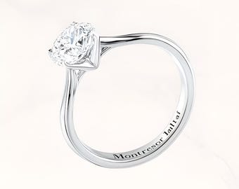 French-style 18K white gold engagement ring | A light and graceful symbol of love.