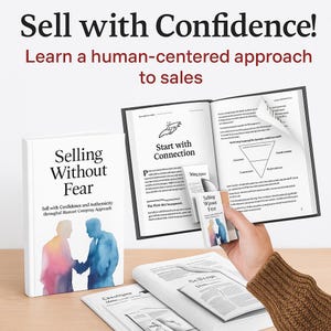 May include: Image of a book titled "Selling Without Fear" with the text "Sell with Confidence and Authenticity through Humoet Compray Approach." The book is white with a watercolour illustration of two people shaking hands. The image also shows an open book and other printed materials.