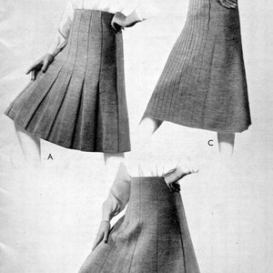 May include: A vintage knitting pattern for three sizes of skirts. The pattern is for a purple heather fingering yarn and is labelled "Patonised" shrink-resist finish. The pattern number is 158.
