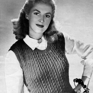 May include: A vintage knitting pattern for a one-piece pullover sweater, knitted in cable stitch. The pattern is for a medium size and uses 3-ply yarn. The pattern is from Bestway and has the number 2256.
