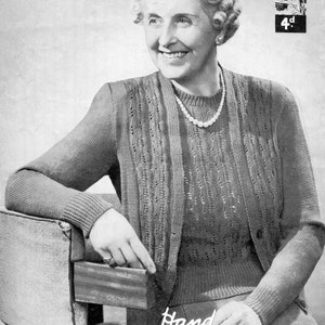 May include: A vintage knitting pattern for a two-piece sweater set in lavender. The pattern is called "Hand Knitwear in Lavenda" and is numbered "No. 960".