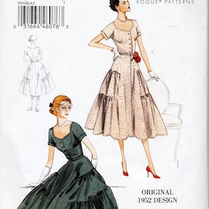 May include: Vintage Vogue sewing pattern for a dress with a fitted bodice and a full skirt. The pattern is for sizes 6-8-10-12-14. The pattern is illustrated with two models wearing the dress in different colors. The dress on the left is green and the dress on the right is pink with white polka dots.