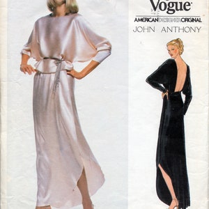 May include: A sewing pattern for a long, flowing gown with a low back. The pattern is from Very Easy Vogue, an American Designer Original by John Anthony. The pattern number is 2075.