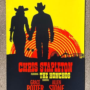 May include: A concert poster with a yellow and black background. Silhouetted figures of a couple holding hands are in the center. The poster advertises a Chris Stapleton concert featuring The Honchos, Grace Potter, and Allen Stone at the Hollywood Bowl.