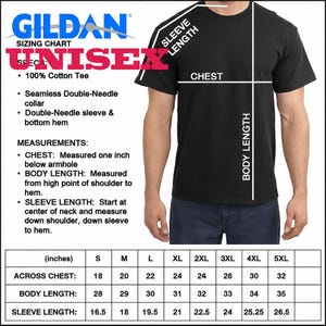 May include: Black Gildan unisex t-shirt with a sizing chart. The chart includes measurements for chest, body length, and sleeve length in inches. The shirt is made of 100% cotton and features a seamless double-needle collar and hem.