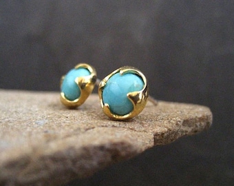 Genuine turquoise stud earrings set in a thorn prong setting