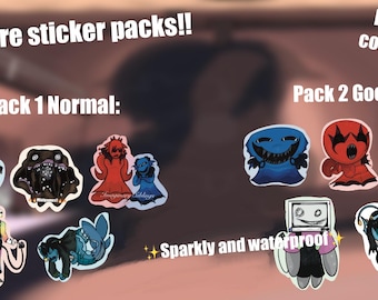 May include: A collection of pressure sticker packs with various cartoon designs. Pack 1 includes a shark, a creature with many eyes, and two figures. Pack 2 features a blue monster, a red figure, and a fish. The stickers are sparkly and waterproof.