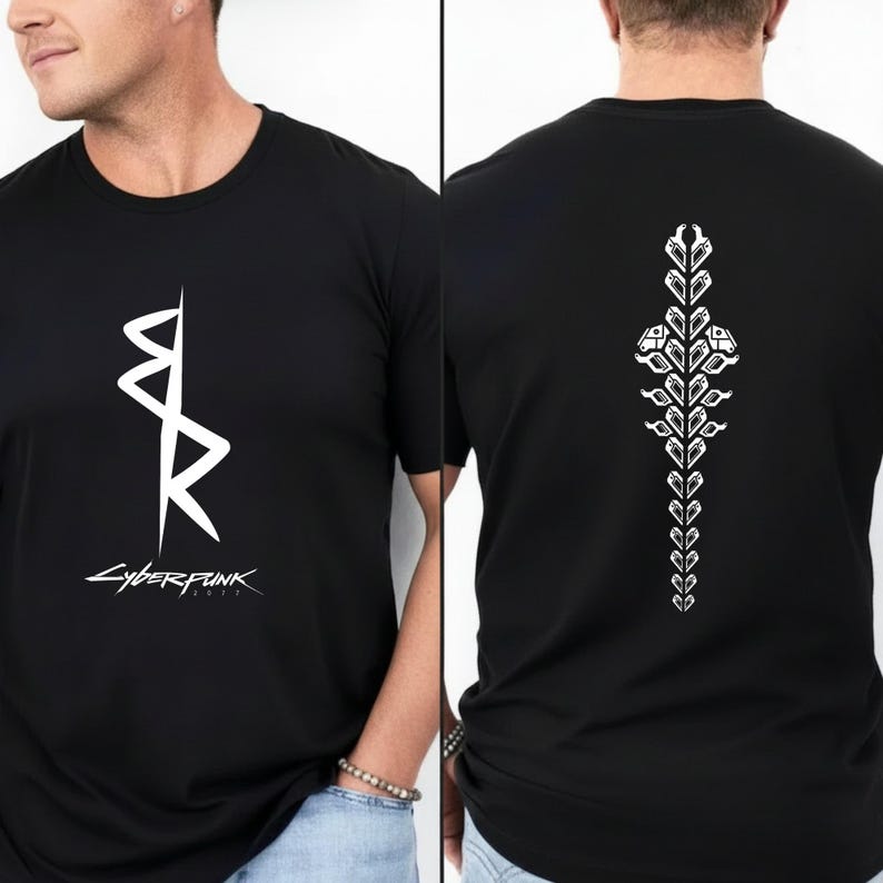 May include: Black t-shirt with a white graphic on the front and back. The front graphic is a stylized design with the word "Cyberpunk 2077" below it. The back features a vertical white design.