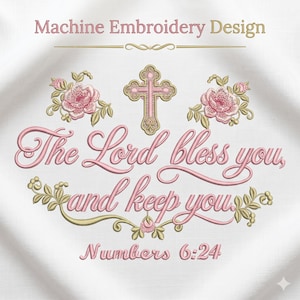 Puede incluir: Un diseño de bordado a máquina con el texto "The Lord bless you, and keep you" y "Numbers 6:24" en letra cursiva rosa. El diseño incluye una cruz dorada central, dos racimos de flores rosas y adornos dorados sobre tela blanca.