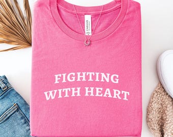 Camiseta "Luchando con corazón, superviviente de cáncer"