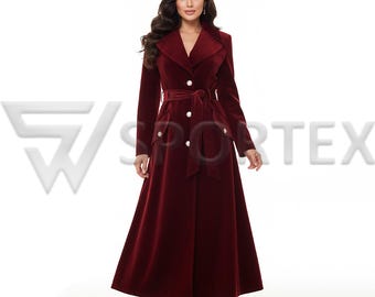 May include: A long, burgundy velvet coat with a belted waist and large lapels. The coat features large, decorative buttons and a flowing skirt. The model is wearing black heels. The coat is a classic, elegant design.