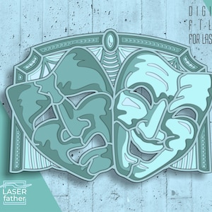 May include: A digital file for laser cutting, featuring a design of two theatrical masks. One mask is a smiling face, the other is a frowning face. The masks are in a teal blue color.