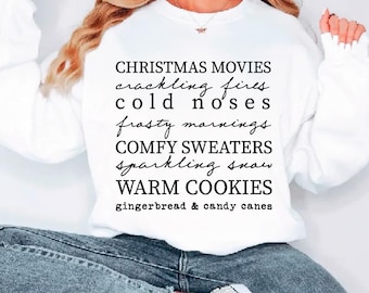 May include: White sweatshirt with the text "CHRISTMAS MOVIES, crackling fires, cold noses, frosty mornings, COMFY SWEATERS, sparkling snow, WARM COOKIES, gingerbread & candy canes." The bottom of the image has the text "SVG PDF EPS DXF PNG."