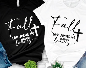 May include: Two t-shirts, one black and one white, each with the text "Fall for Jesus He Never Leaves" in a script font, accompanied by a cross. The bottom of the image displays file type options: SVG, PDF, EPS, DXF, and PNG.