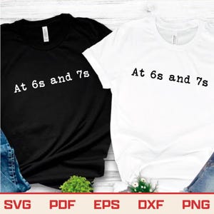 May include: Two t-shirts, one black and one white, with the text "At 6s and 7s" printed in a typewriter-style font. The shirts are short-sleeved and appear to be made of cotton. The bottom of the image shows file type icons.