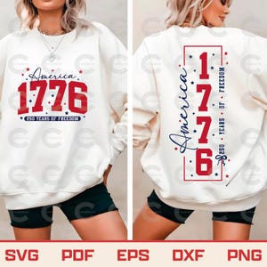 May include: Cream-colored sweatshirt with the text "America 1776" in red, with the words "250 Years of Freedom" below. The back of the sweatshirt has the same design, with the text "America" vertically.