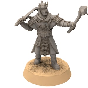 May include: A grey miniature figurine of a warrior in armour, holding a sword and a mace. The figure stands on a tan circular base. The warrior wears a helmet and detailed armour.