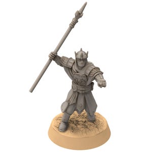 May include: A gray plastic miniature figurine of a warrior holding a spear, wearing a helmet and armor, standing on a brown base.