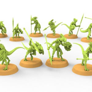 May include: A collection of ten green miniature fantasy figures, each posed on a tan base. The figures are humanoid lizard-like creatures, some holding spears and shields. The figures are designed for tabletop gaming.
