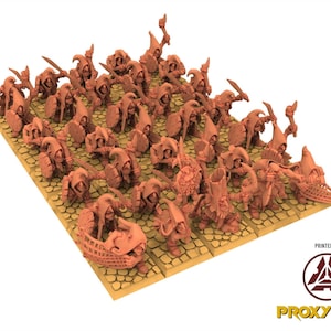 May include: A group of miniature fantasy figures, possibly for tabletop gaming. The figures are a uniform reddish-brown colour and are arranged on a textured, square-tiled base. Some figures hold weapons like swords and bows. The text "PRINTED BY" and "PROXYWARS" is visible.